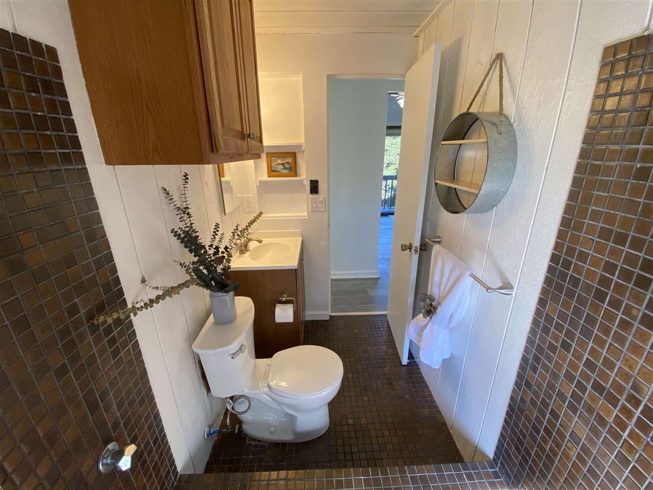180 Ainakula Road Kula, HI 96790 - Photo 22 of 30 a bathroom with a toilet and a mirror