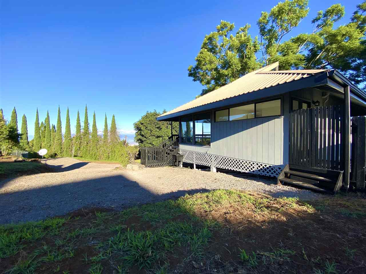 180 Ainakula Road Kula, HI 96790 - Photo 7 of 30 a view of a house with wooden floor and a yard