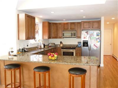 711 Great Neck Road South Mashpee, MA 02649 - Photo 4 of 6 a kitchen with granite countertop a sink stove and refrigerator
