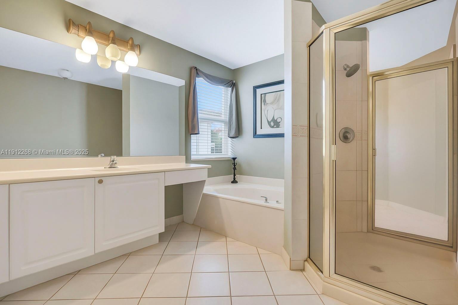 16285 Southwest 19th Street Miramar, FL 33027 - Photo 15 of 36 a bathroom with a double vanity sink mirror and shower