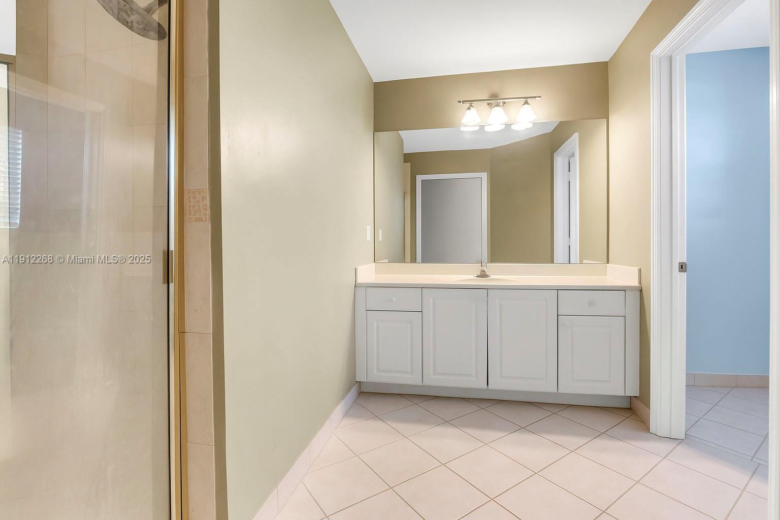 16285 Southwest 19th Street Miramar, FL 33027 - Photo 16 of 36 a view of a hallway with chandelier