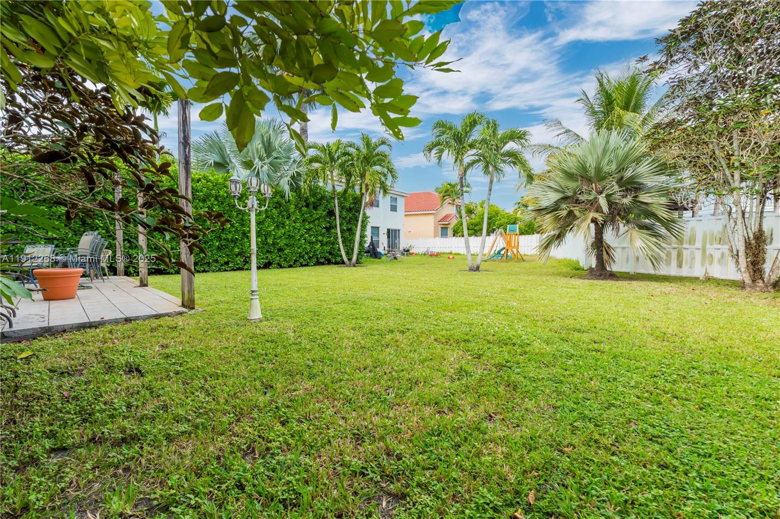 16285 Southwest 19th Street Miramar, FL 33027 - Photo 19 of 36 a view of a tree in front of a house