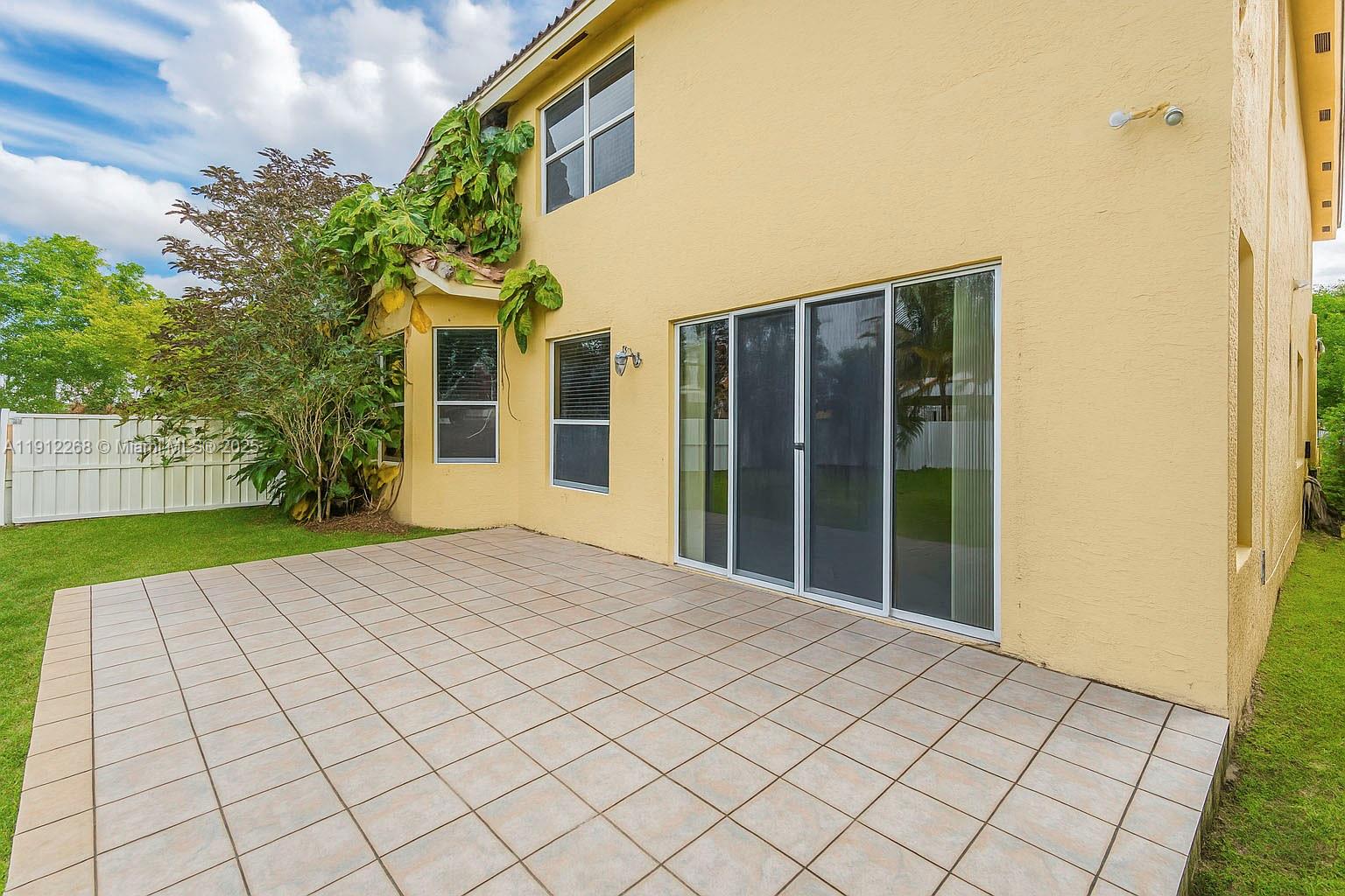 16285 Southwest 19th Street Miramar, FL 33027 - Photo 20 of 36 a view of a building with a sink and a yard