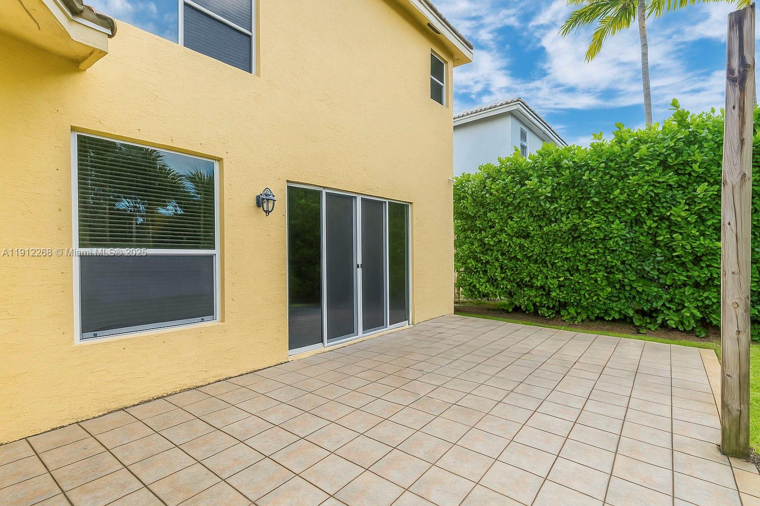 16285 Southwest 19th Street Miramar, FL 33027 - Photo 21 of 36 a view of backyard with potted plants
