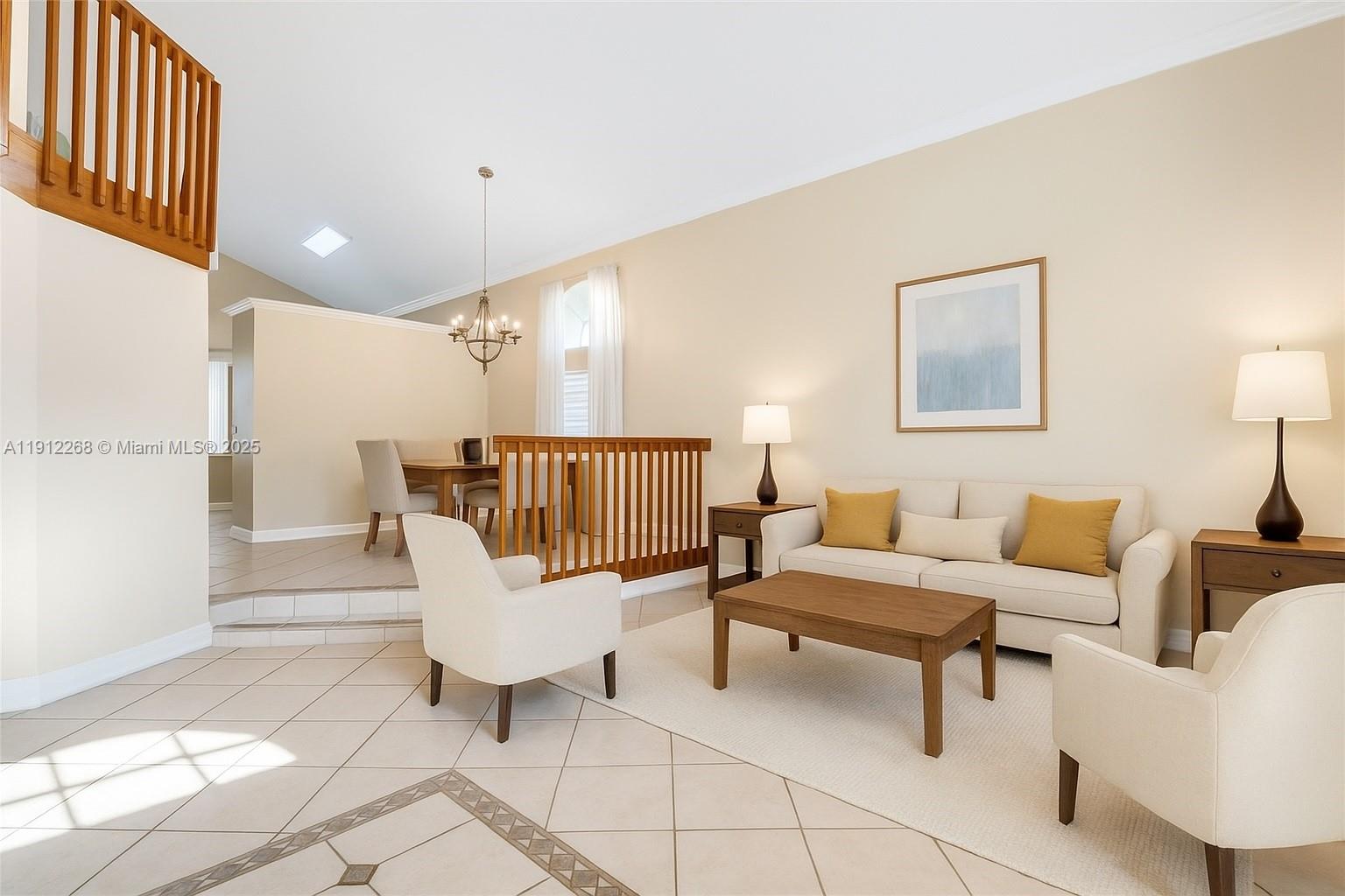 16285 Southwest 19th Street Miramar, FL 33027 - Photo 5 of 36 a living room with furniture and a lamp