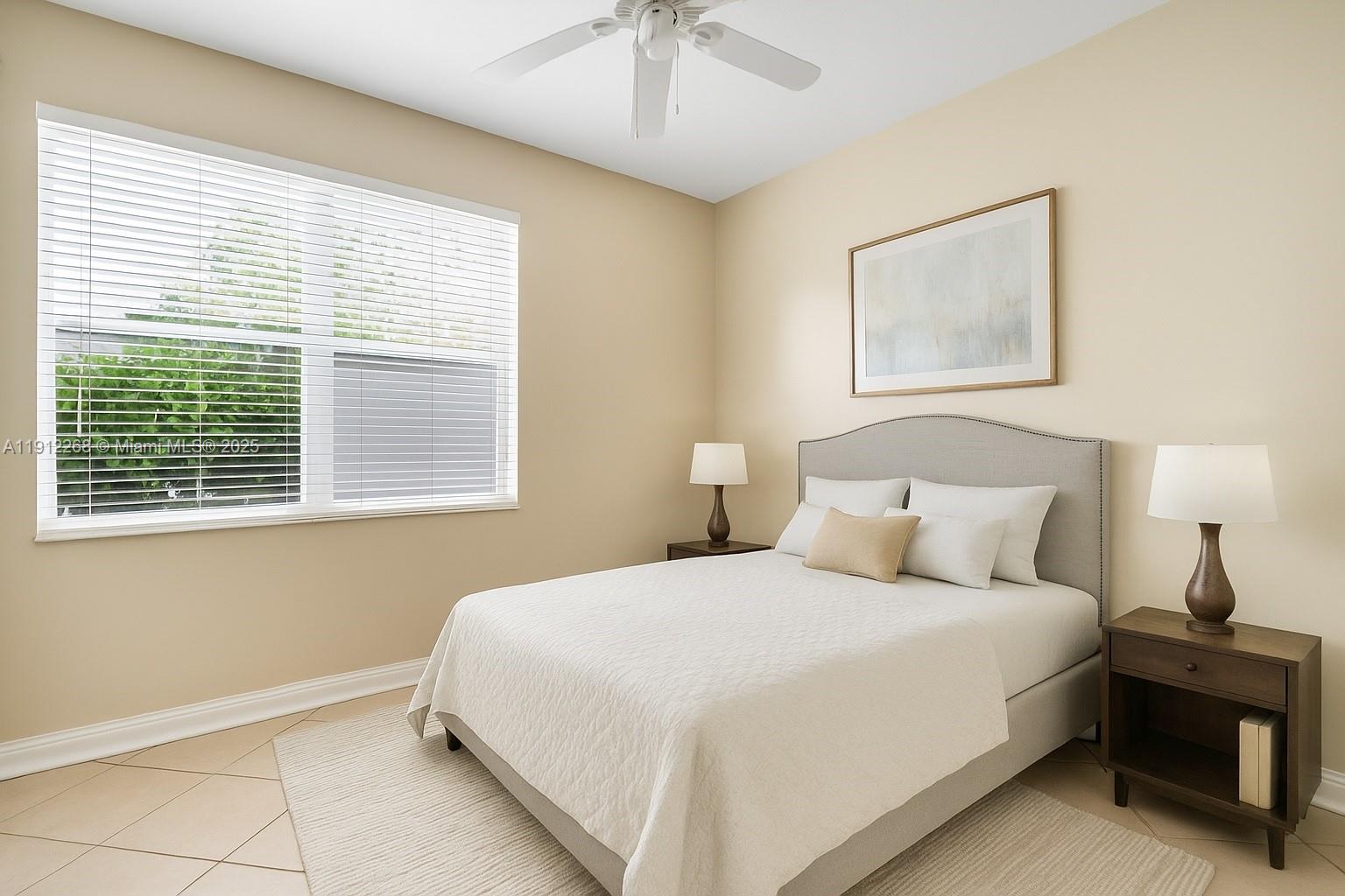 16285 Southwest 19th Street Miramar, FL 33027 - Photo 9 of 36 a bedroom with a bed and a chandelier