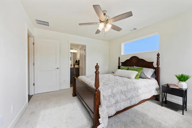 a bed room with a bed and a chandelier