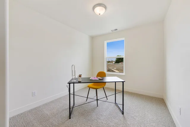 a workspace with furniture and wooden floor
