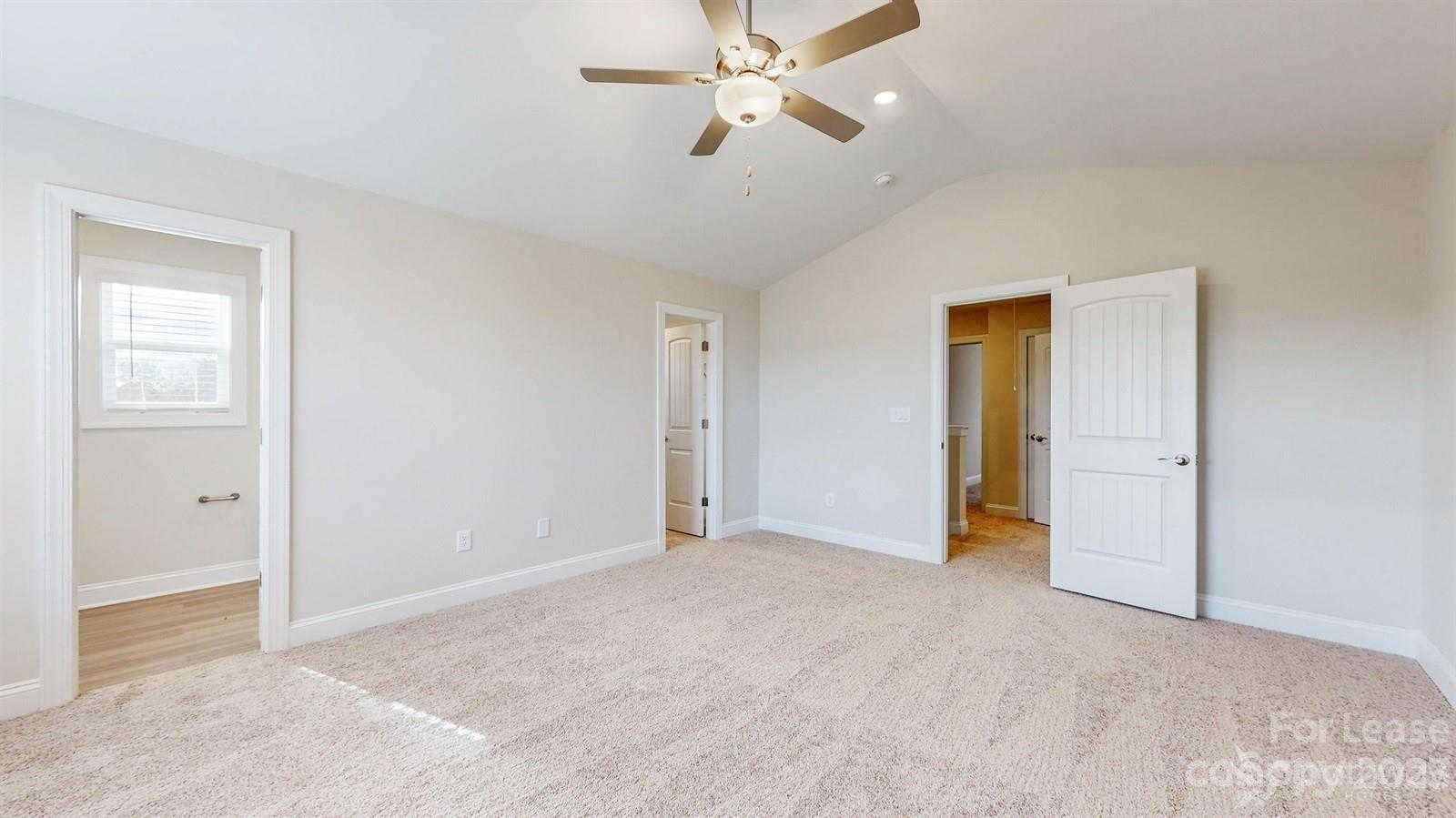 163 Brixham Loop Troutman, NC 28166 - Photo 14 of 34 a view of empty room with ceiling fan