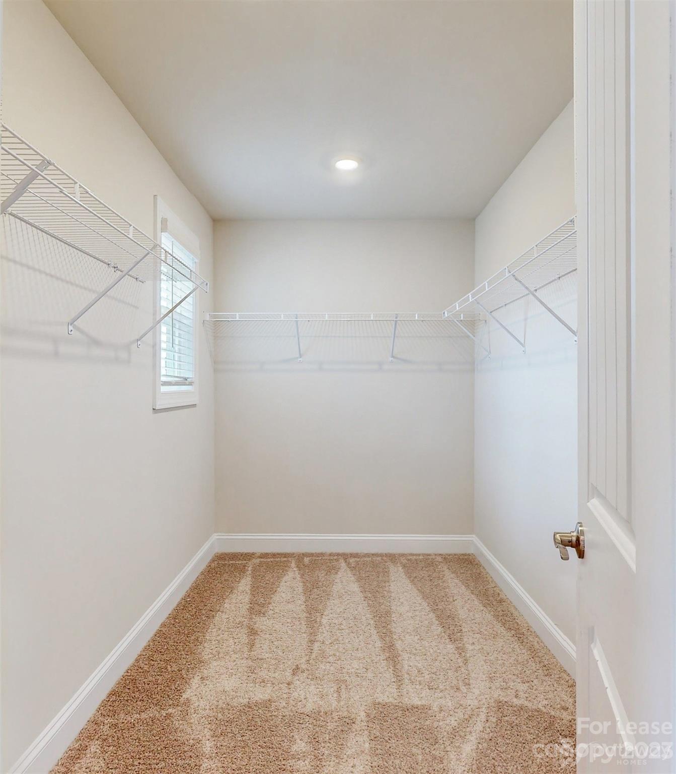 163 Brixham Loop Troutman, NC 28166 - Photo 16 of 34 a view of a room with racks on the wall