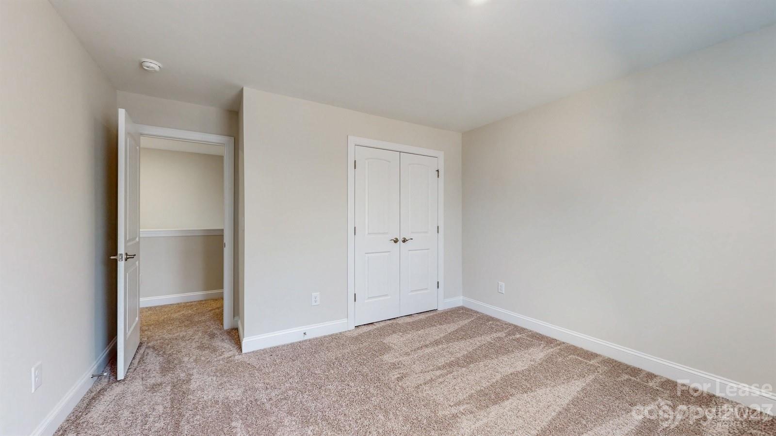 163 Brixham Loop Troutman, NC 28166 - Photo 22 of 34 a view of an empty room