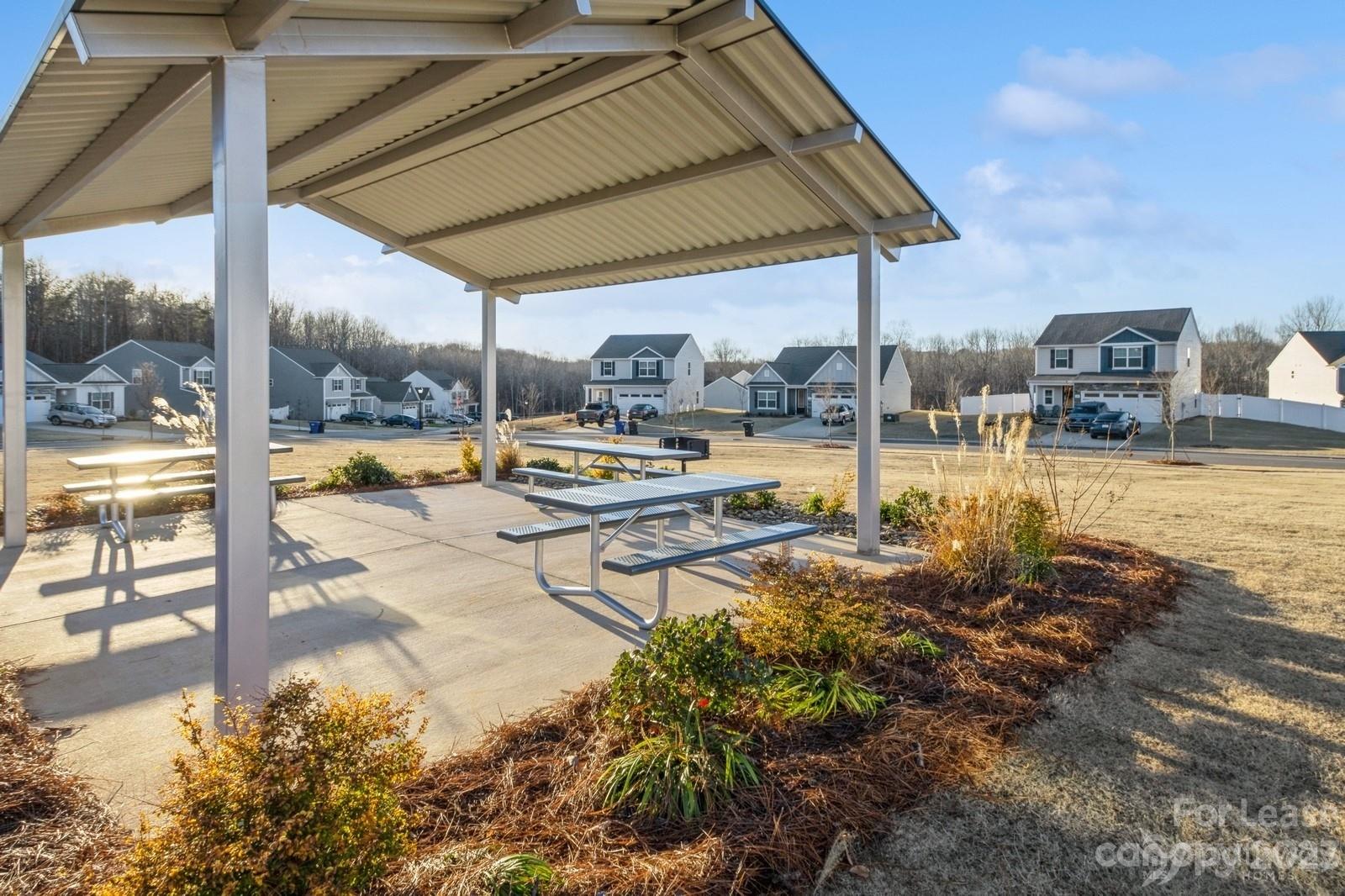 163 Brixham Loop Troutman, NC 28166 - Photo 32 of 34 a view of a swimming pool with a lounge chairs