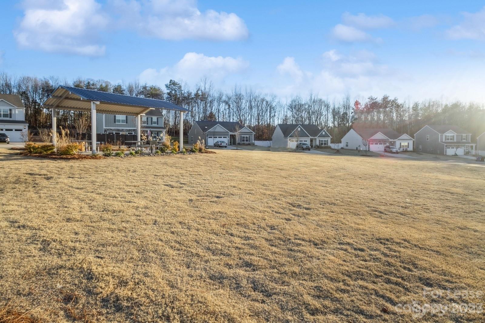 163 Brixham Loop Troutman, NC 28166 - Photo 33 of 34 a view of a houses with city view