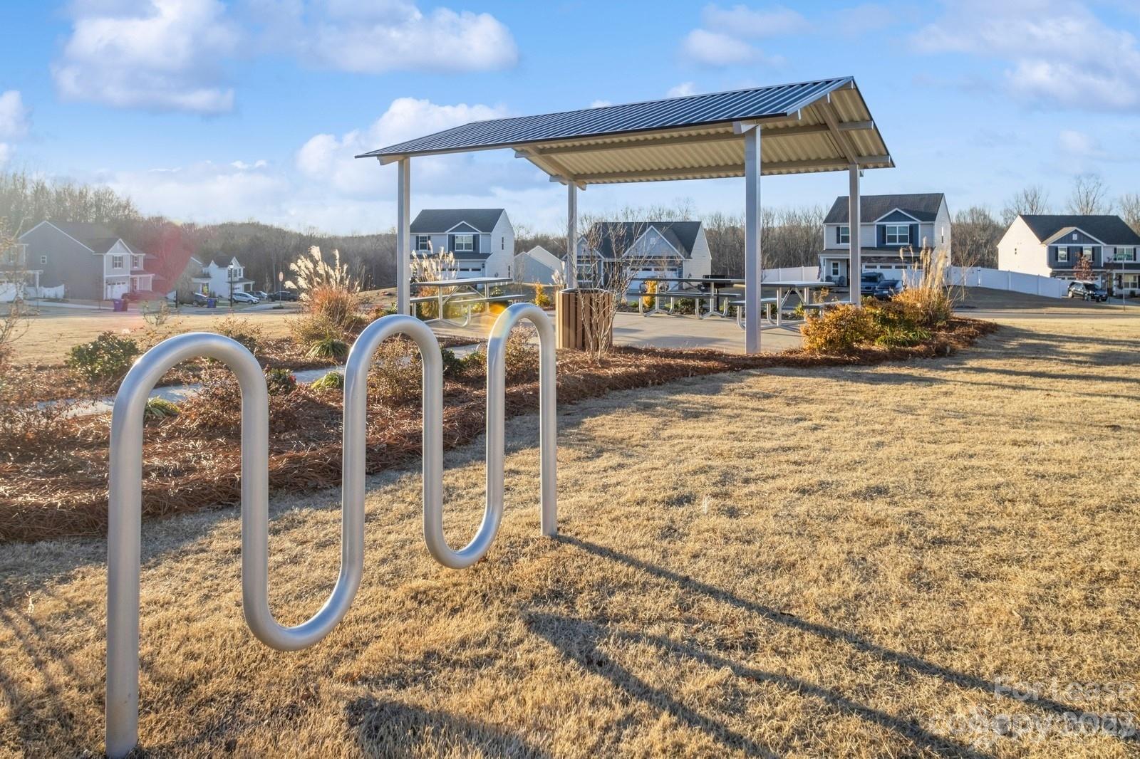 163 Brixham Loop Troutman, NC 28166 - Photo 34 of 34 a view of swimming pool with outdoor seating and city view