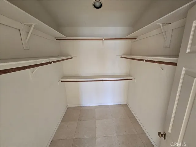 a bathroom with a double vanity sink and mirror with shower