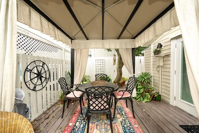 1218 Packer Street, Unit REAR Key West, FL 33040 - Photo 13 of 22 a view of a porch with furniture