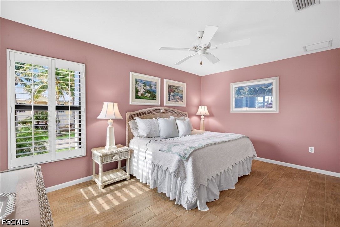 1057 Sand Castle Road Sanibel, FL 33957 - Photo 30 of 50 a bed room with a bed and a window