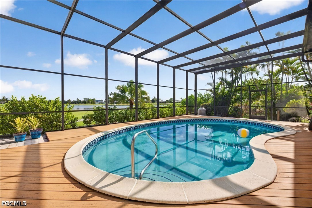 1057 Sand Castle Road Sanibel, FL 33957 - Photo 3 of 50 a view of a swimming pool with a porch