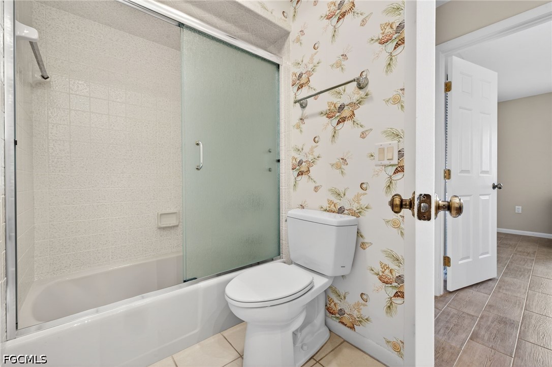 1057 Sand Castle Road Sanibel, FL 33957 - Photo 33 of 50 a bathroom with a toilet and a shower