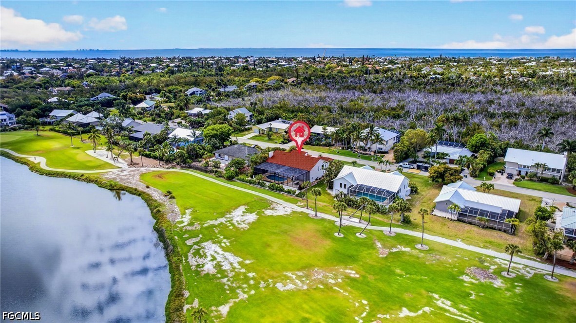1057 Sand Castle Road Sanibel, FL 33957 - Photo 47 of 50 an aerial view of residential houses with outdoor space and swimming pool