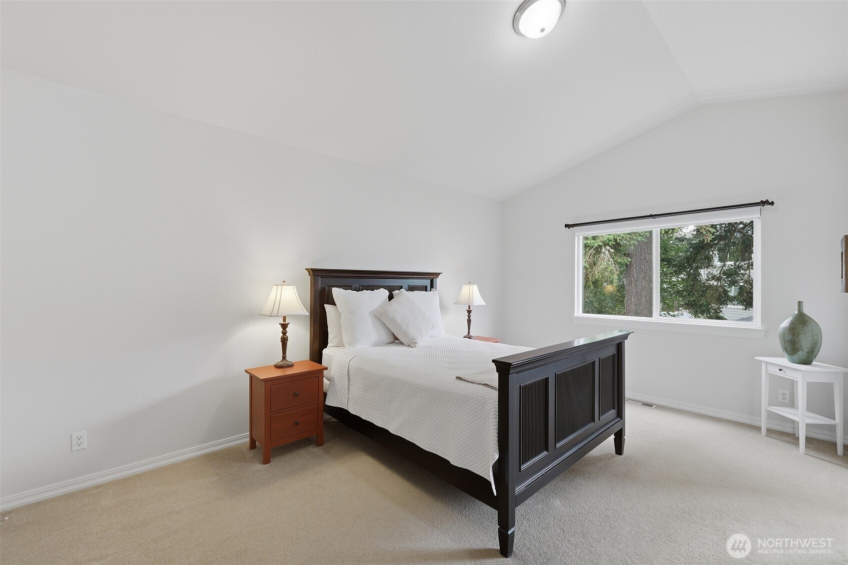 17747 89th Court Northeast Bothell, WA 98011 - Photo 18 of 33 a bed sitting in a room next to a window
