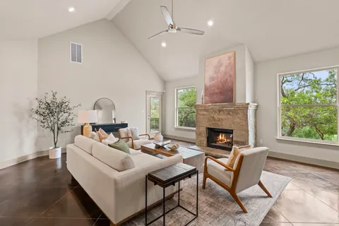 a living room with furniture and a fireplace