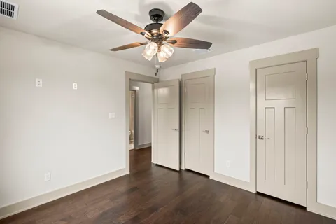 a view of an empty room with a fan