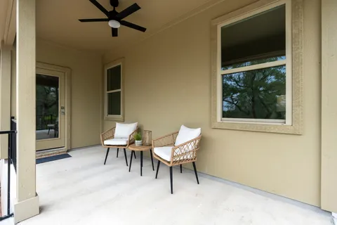 a work room with a chair and a window