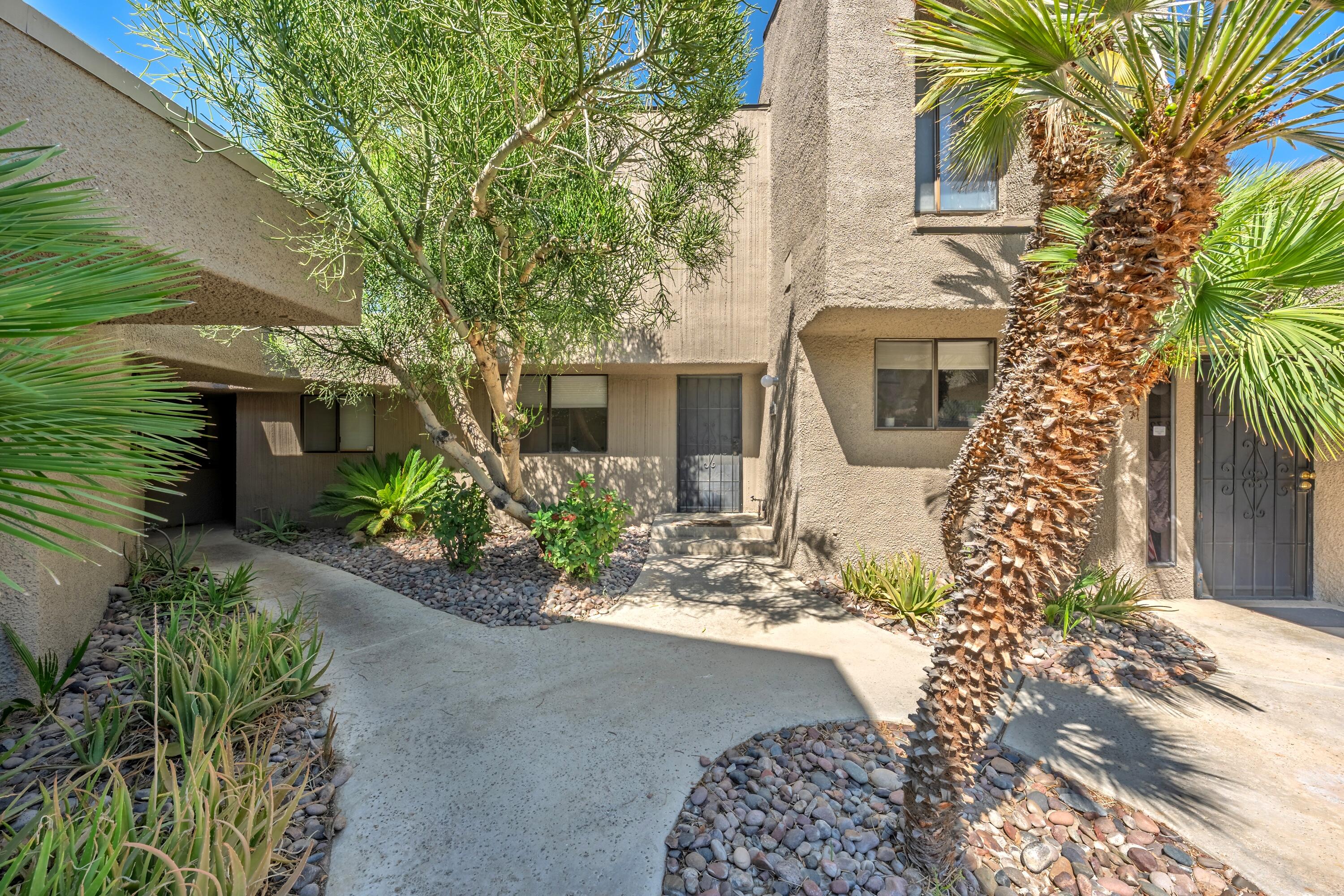 71870 Eleanora Lane Rancho Mirage, CA 92270 - Photo 31 of 36 a front view of a house with a garden