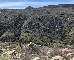 0 Lot 6 Scorpion Canyon Road Hemet, CA 92544 - Photo 6 of 6 a view of a large building with a mountain in the background
