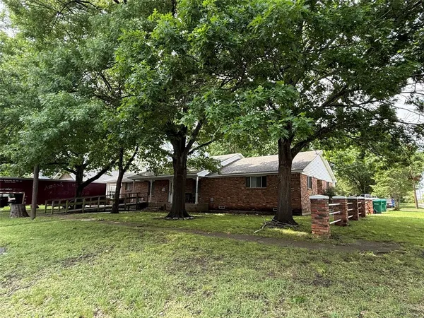 a front view of house with garden