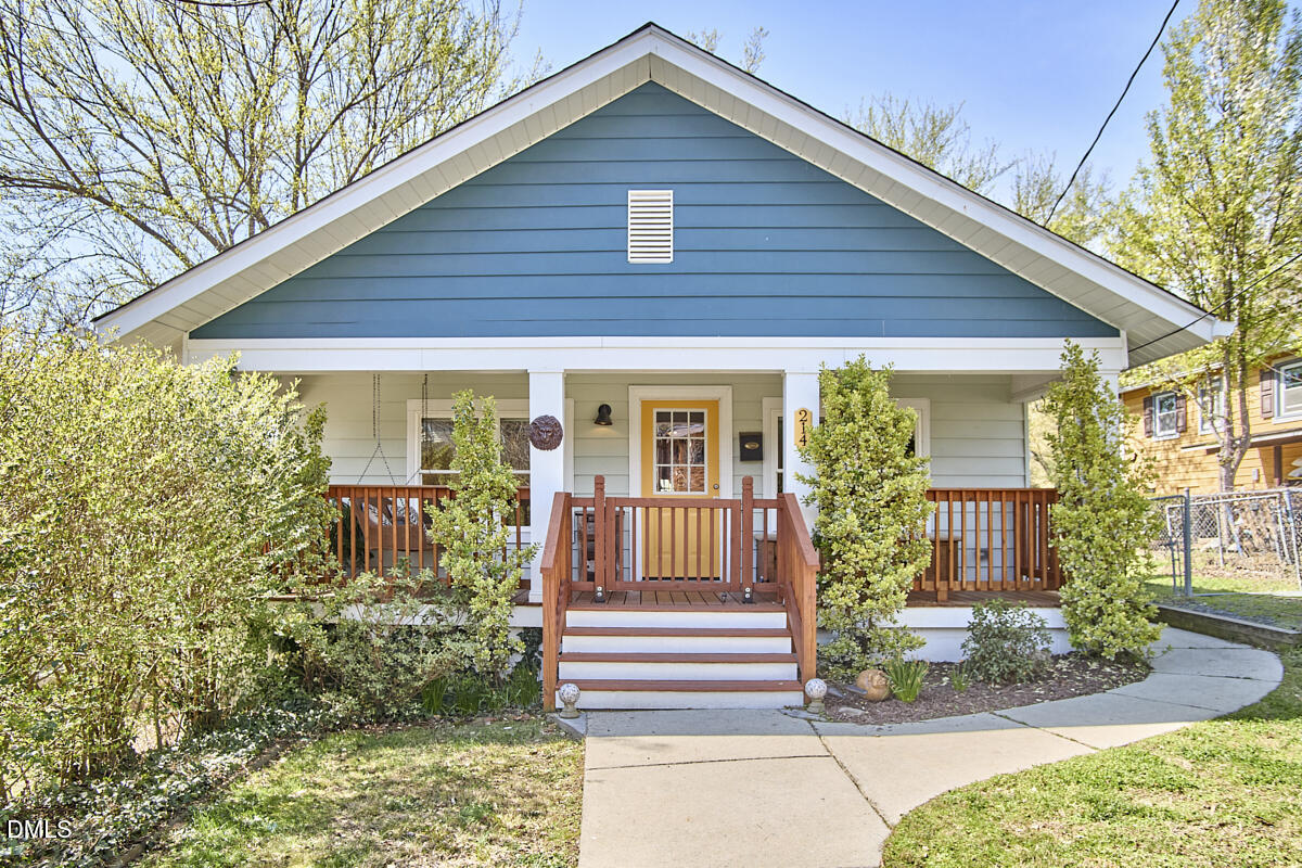 214 Moline Street Durham, NC 27707 - Photo 1 of 49 a front view of a house with garden