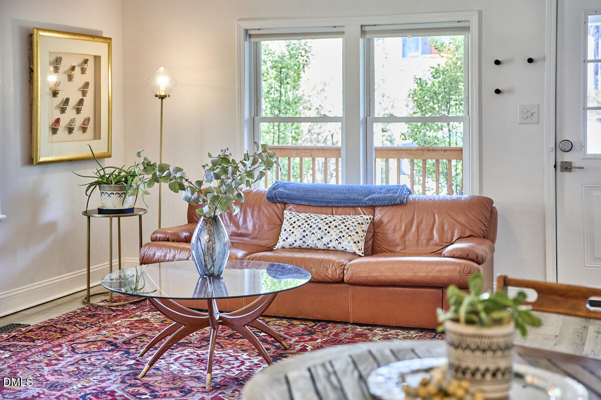 214 Moline Street Durham, NC 27707 - Photo 10 of 49 a living room with furniture potted plant and window