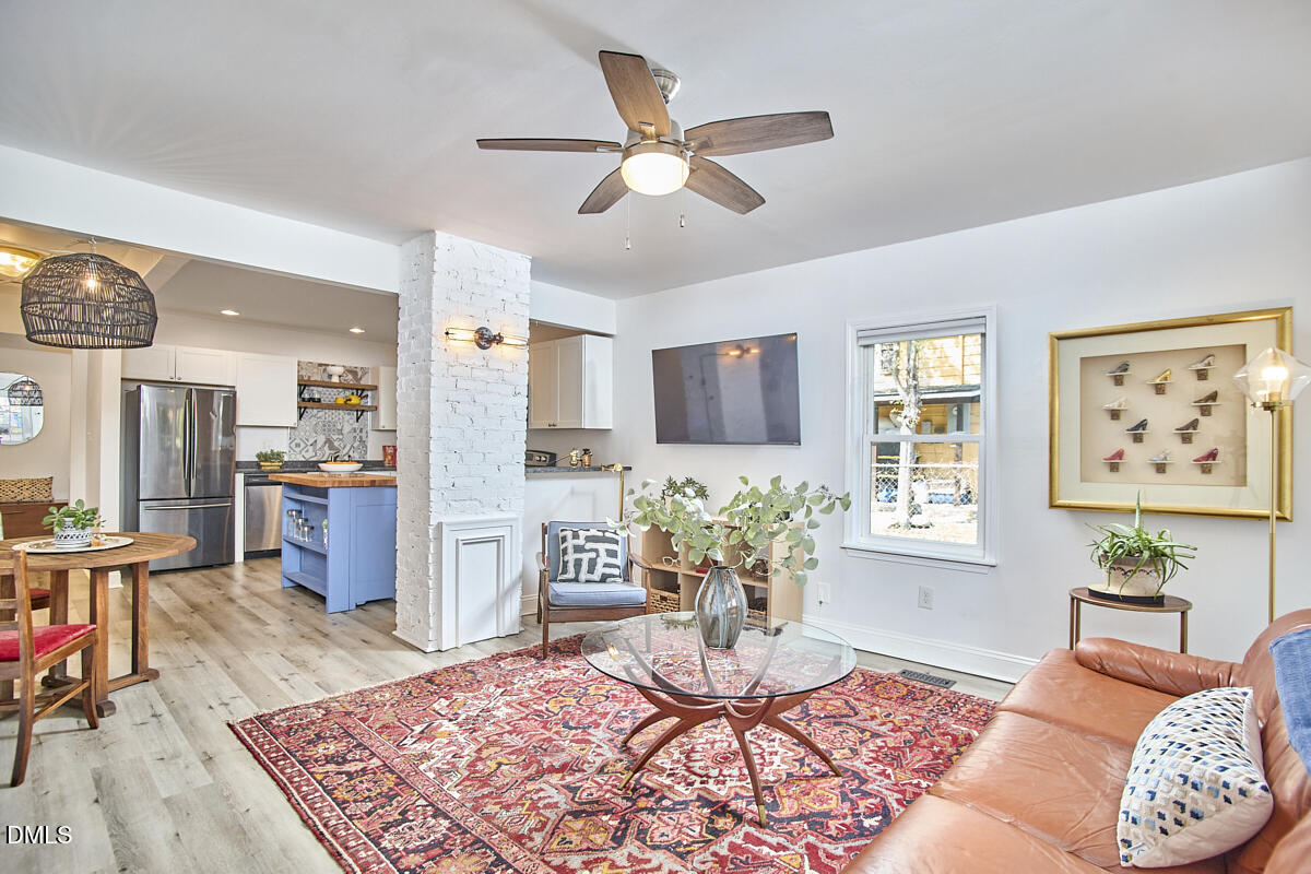214 Moline Street Durham, NC 27707 - Photo 12 of 49 a living room with furniture rug and window