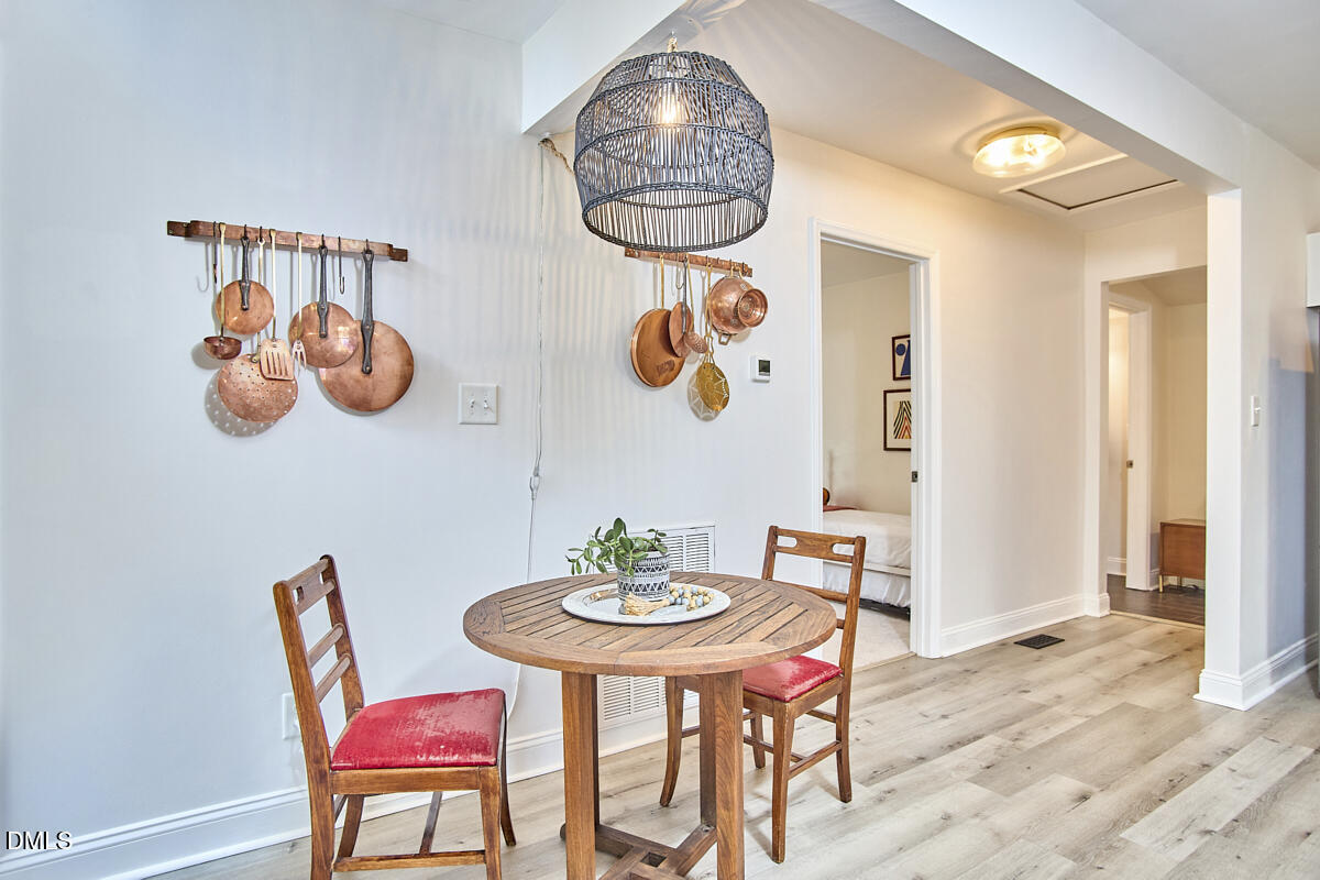 214 Moline Street Durham, NC 27707 - Photo 22 of 49 a view of a dining room with furniture and chandelier