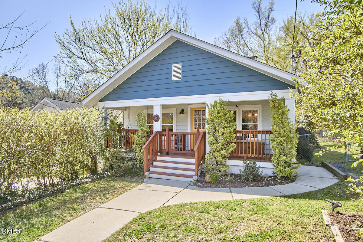 214 Moline Street Durham, NC 27707 - Photo 2 of 49 a front view of a house with garden