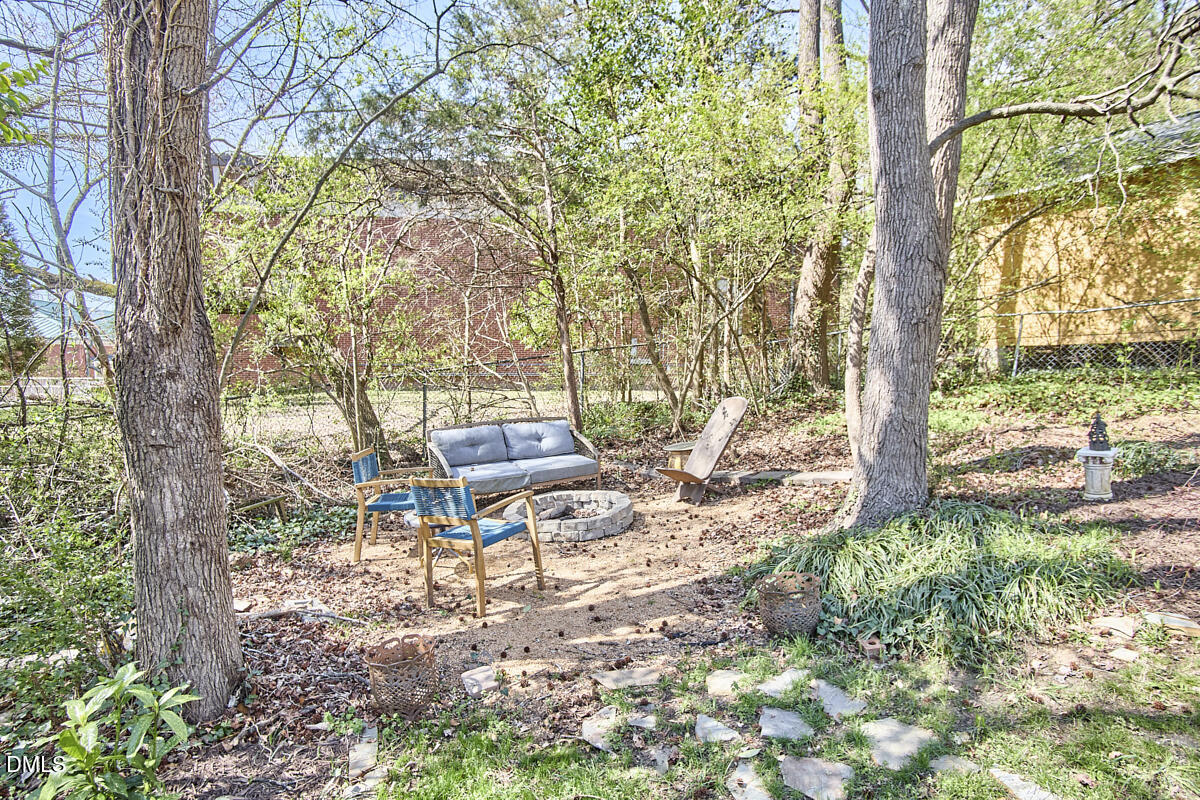214 Moline Street Durham, NC 27707 - Photo 47 of 49 a backyard of a house with table and chairs