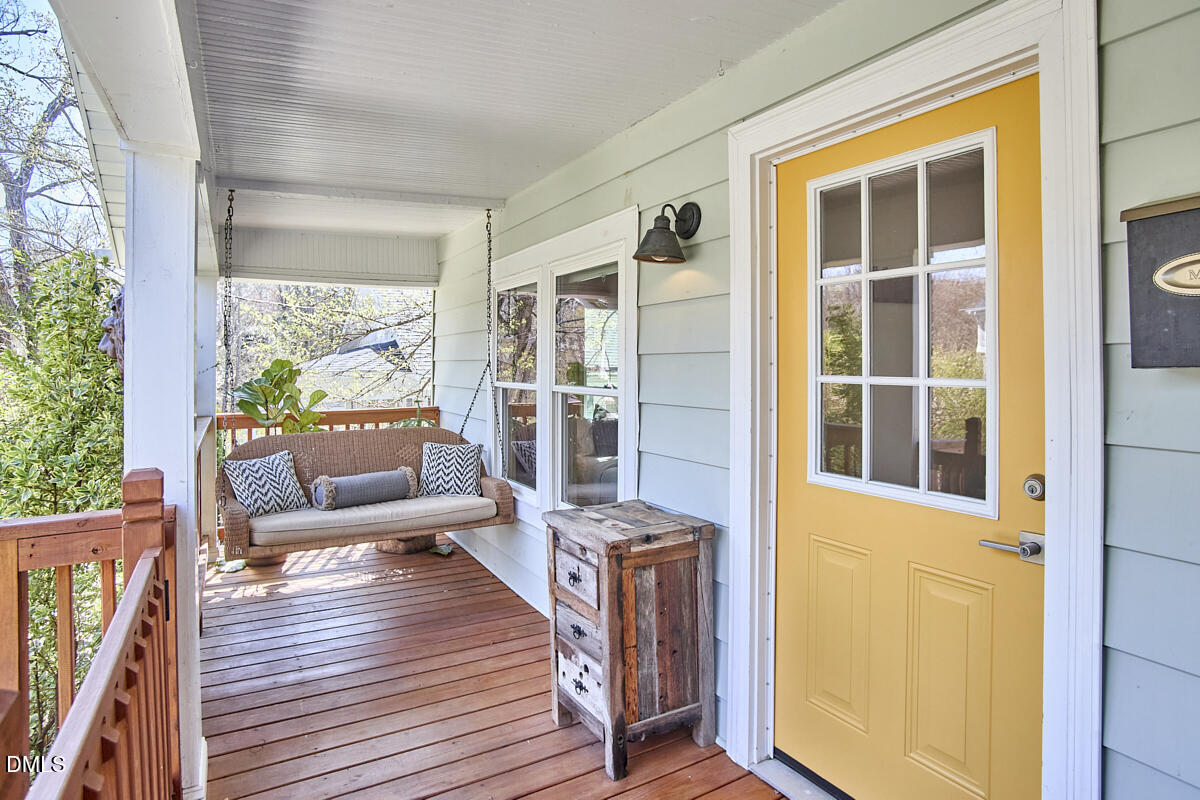 214 Moline Street Durham, NC 27707 - Photo 4 of 49 a balcony with furniture and wooden floor
