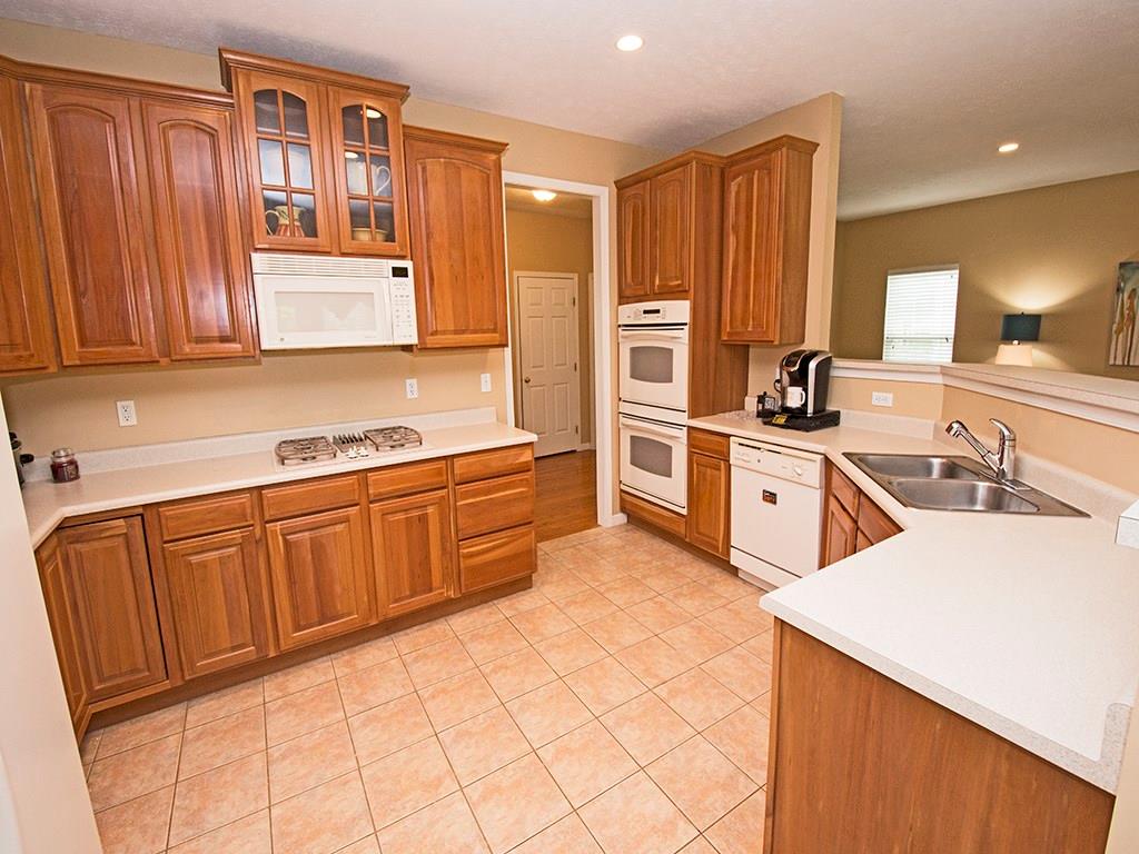 215 Cliffside Drive Mars, PA 16046 - Photo 13 of 23 a kitchen with stainless steel appliances a sink dishwasher stove refrigerator and cabinets