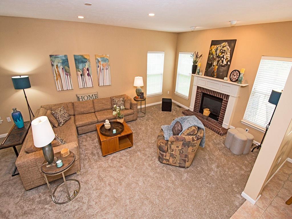 215 Cliffside Drive Mars, PA 16046 - Photo 8 of 23 a living room with furniture a fireplace and a flat screen tv