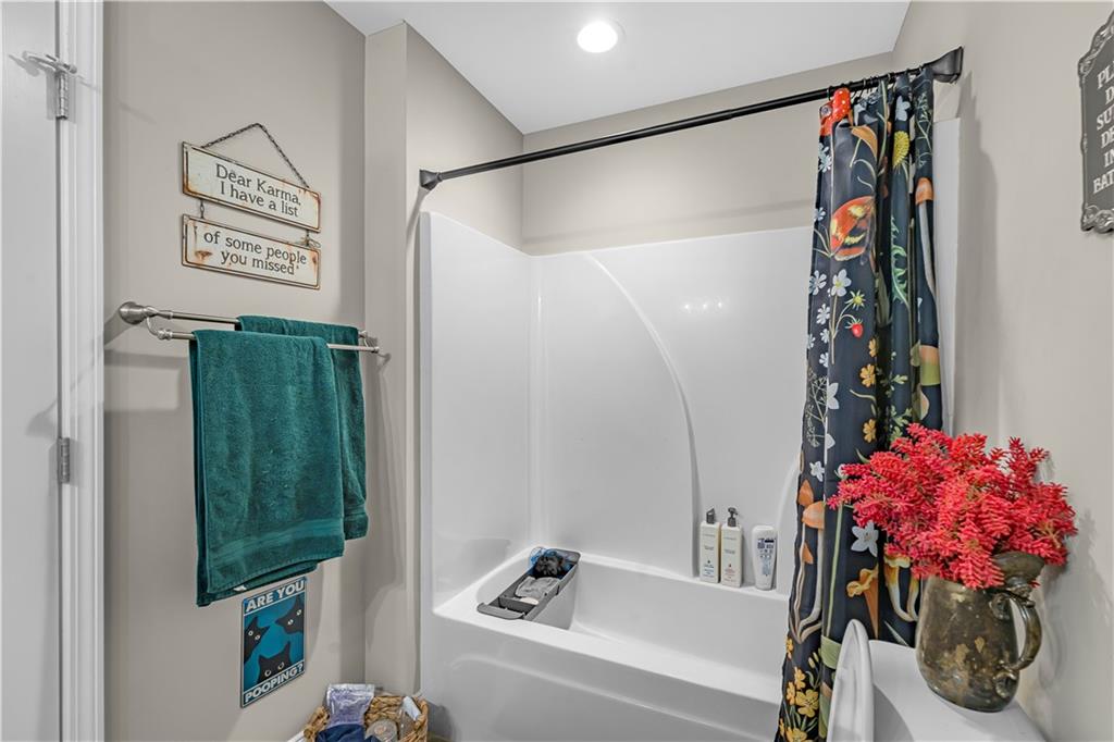 2383 Sperin Road Ball Ground, GA 30107 - Photo 14 of 38 a bathroom with a bathtub and shower