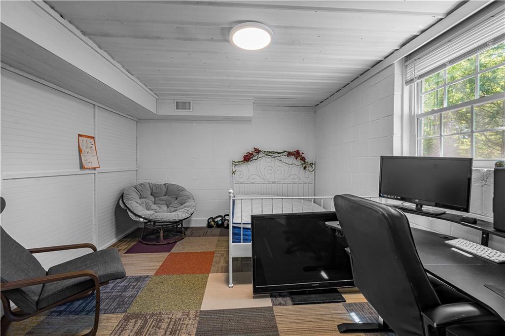 2383 Sperin Road Ball Ground, GA 30107 - Photo 20 of 38 a room with furniture and a flat screen tv