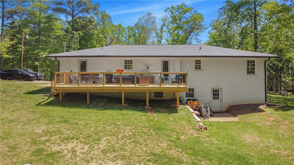 2383 Sperin Road Ball Ground, GA 30107 - Photo 30 of 38 a view of a house with a yard and sitting area