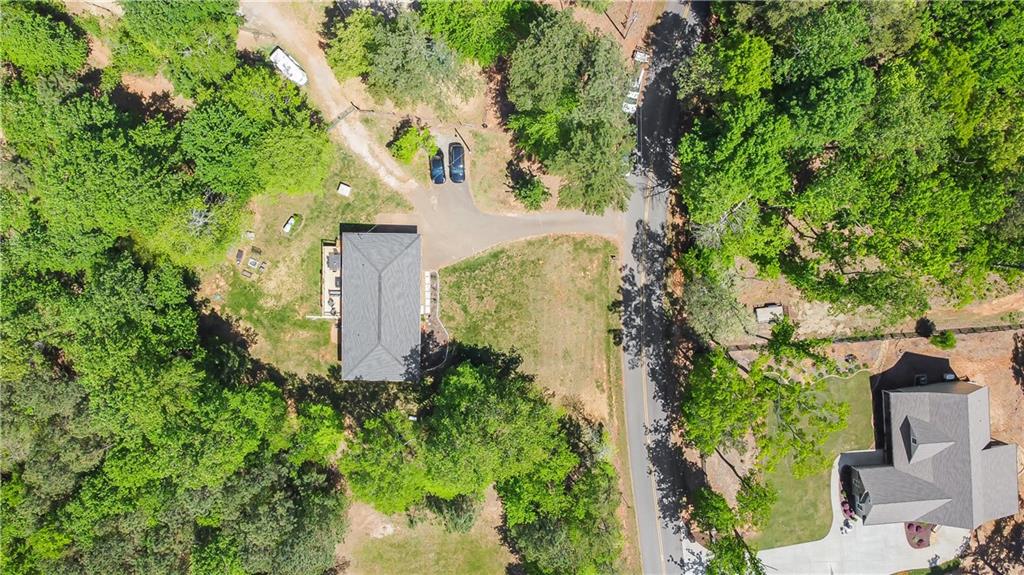 2383 Sperin Road Ball Ground, GA 30107 - Photo 3 of 38 an aerial view of a house with a yard