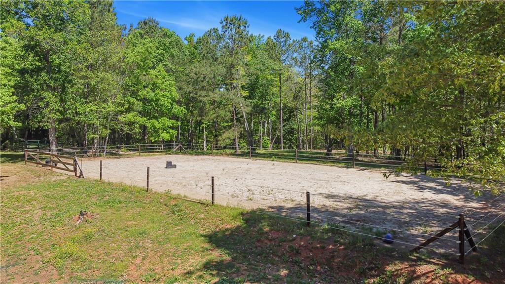 2383 Sperin Road Ball Ground, GA 30107 - Photo 32 of 38 a view of a field with trees in the background