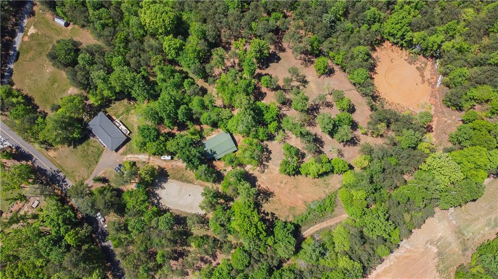 2383 Sperin Road Ball Ground, GA 30107 - Photo 34 of 38 an aerial view of residential house with outdoor space and trees all around