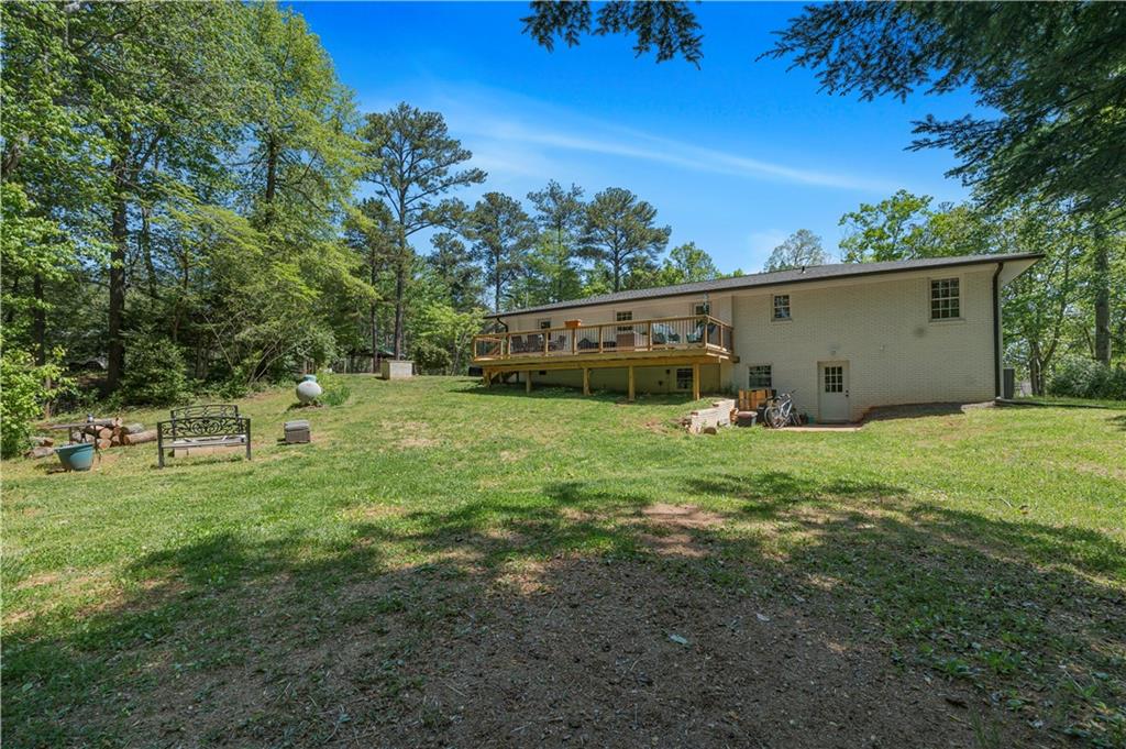 2383 Sperin Road Ball Ground, GA 30107 - Photo 38 of 38 a backyard of a house with lots of green space