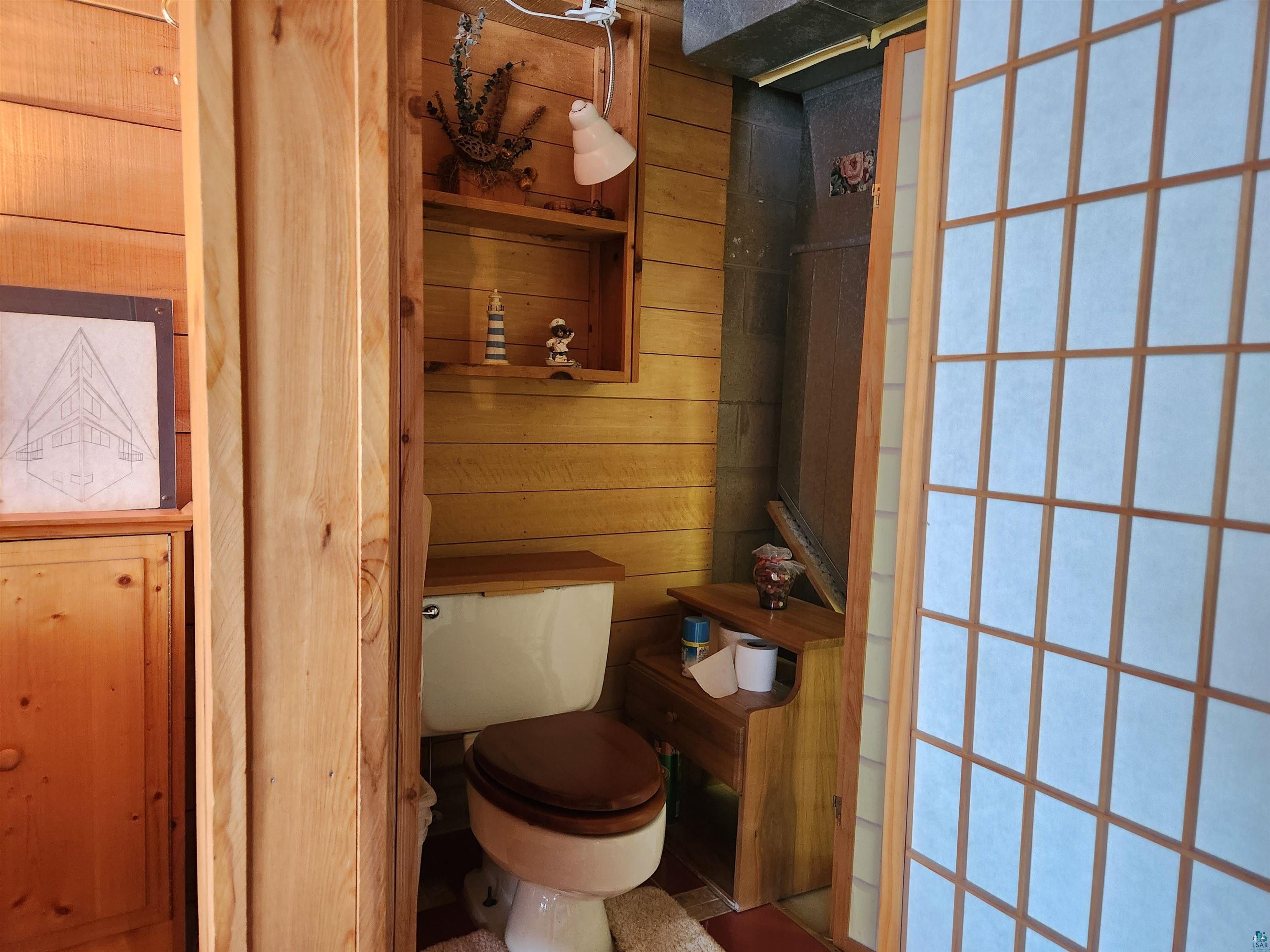 332 North 1st Street Bayfield, WI 54814 - Photo 25 of 30 Lower level toilet area with wall divider for privacy