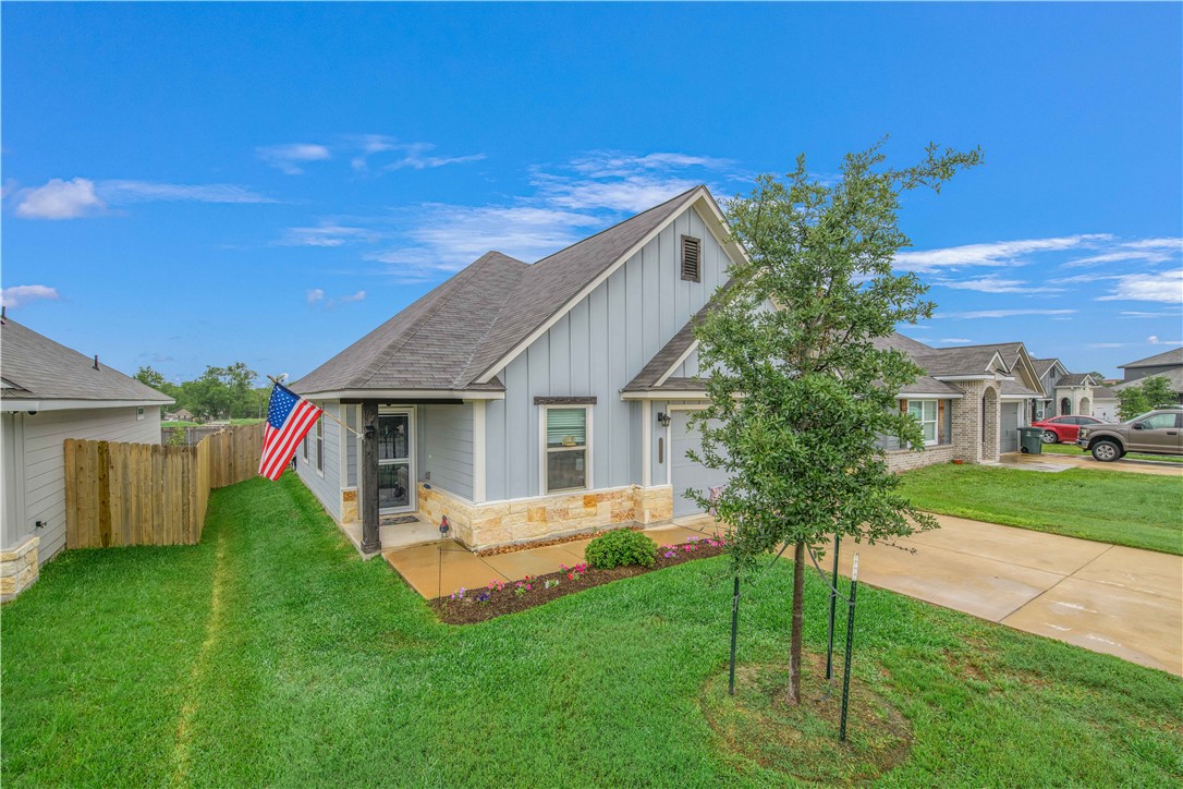 2850 Messenger Way Bryan, TX 77803 - Photo 1 of 17 a front view of a house with a garden and yard