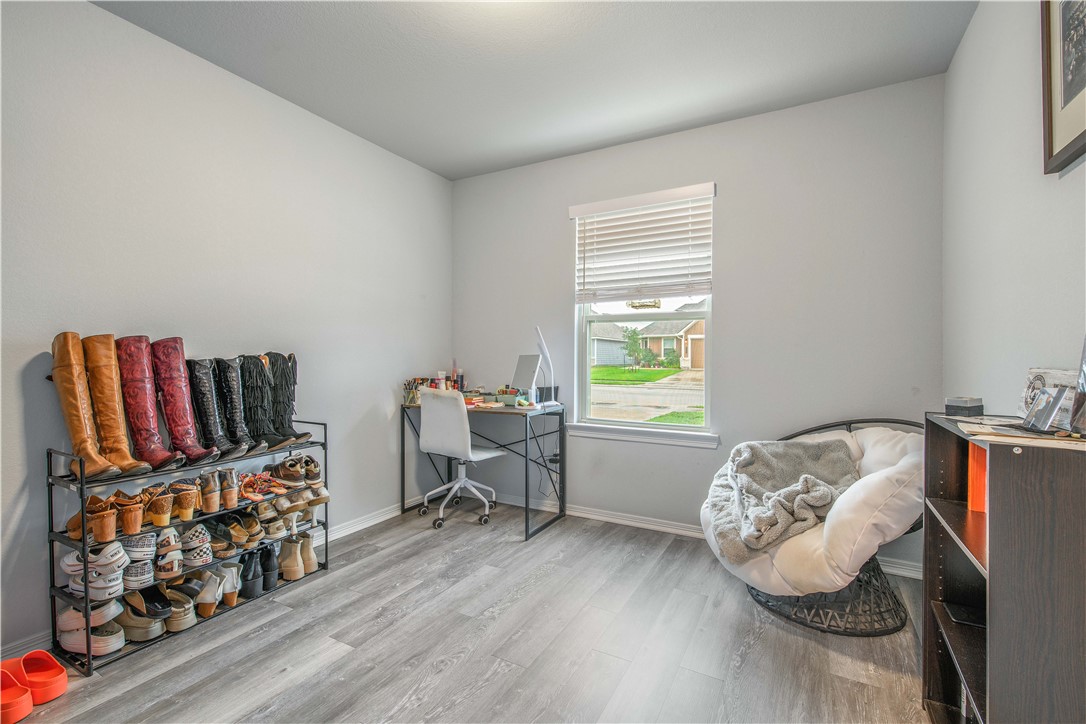 2850 Messenger Way Bryan, TX 77803 - Photo 11 of 17 a bedroom with furniture and a wooden floor
